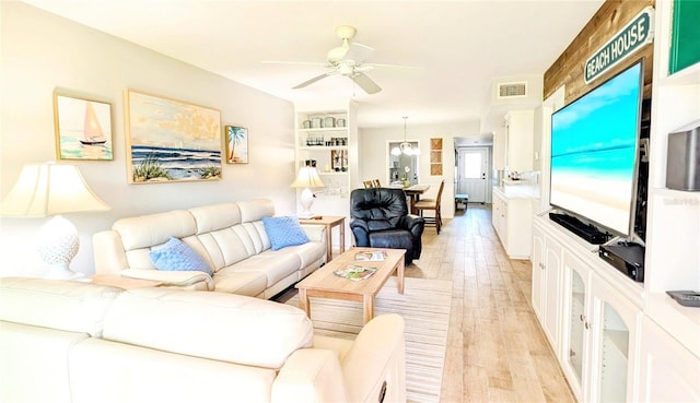 512 W Venice Ave Unit 102, Venice, FL 34285 - living room with a ceiling fan and light wood-style floors