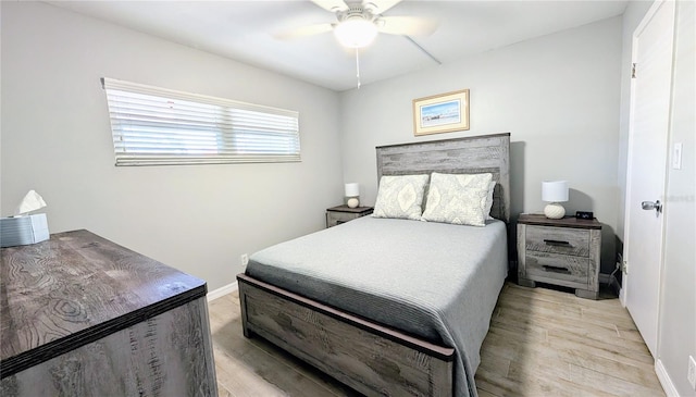 512 W Venice Ave Unit 102, Venice, FL 34285 - bedroom with light wood-type flooring, baseboards, and ceiling fan