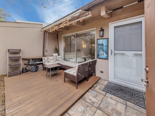 wooden deck featuring an outdoor hangout area