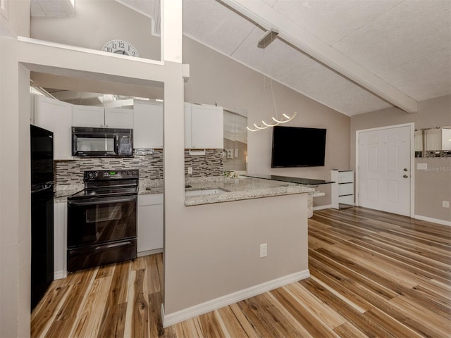 kitchen with white cabinetry, black appliances, vaulted ceiling with beams, and light wood finished floors