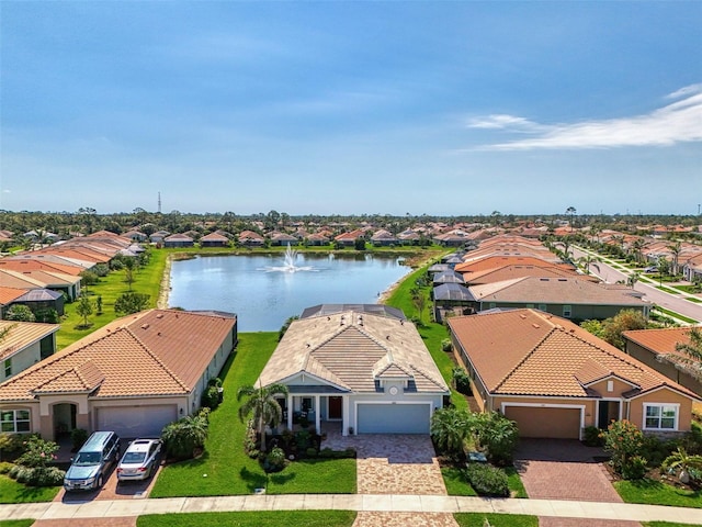 aerial view featuring a residential view and a water view