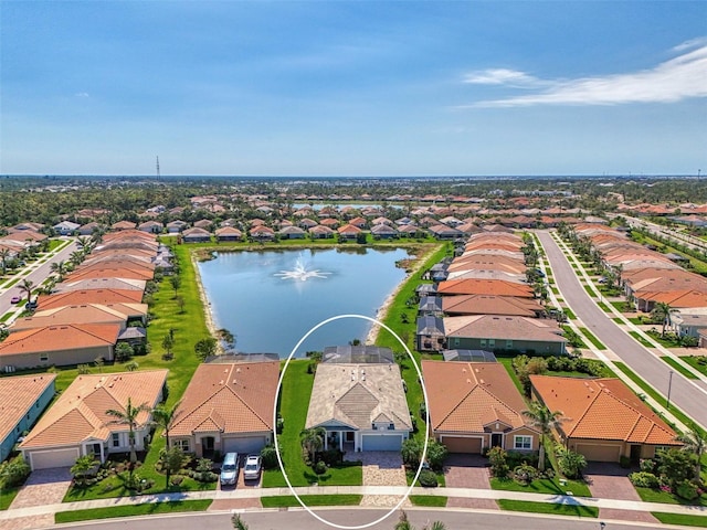 birds eye view of property featuring a residential view and a water view