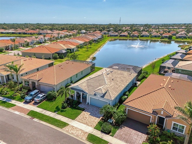 birds eye view of property featuring a water view and a residential view