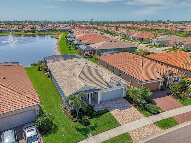 bird's eye view with a residential view and a water view