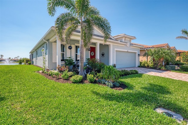 view of front facade featuring a front lawn, decorative driveway, a garage, and stucco siding