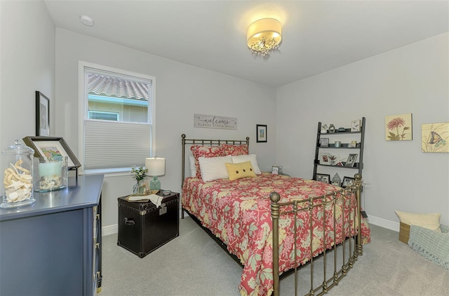 bedroom featuring baseboards and carpet flooring