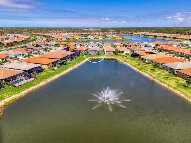 bird's eye view with a water view and a residential view