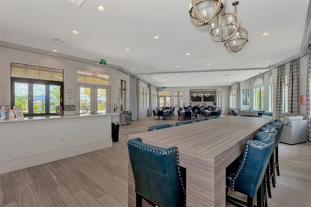 dining area with french doors, visible vents, light wood-style floors, and recessed lighting