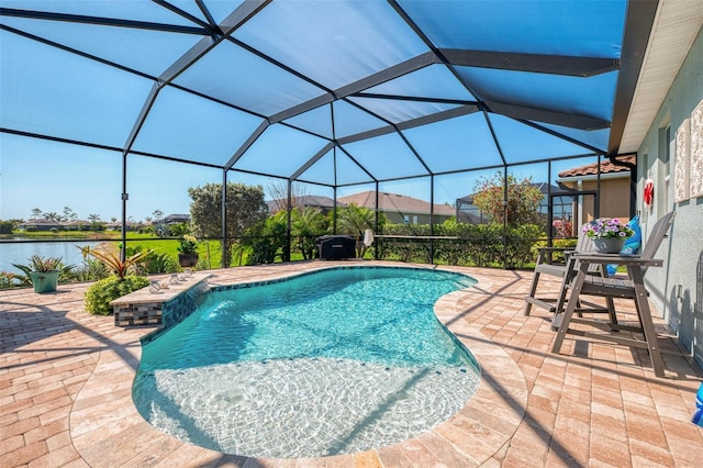 outdoor pool featuring a water view, glass enclosure, and a patio