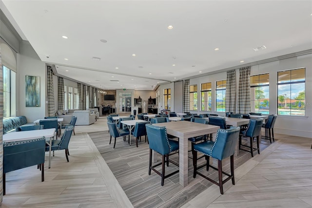 dining area featuring baseboards, visible vents, and recessed lighting