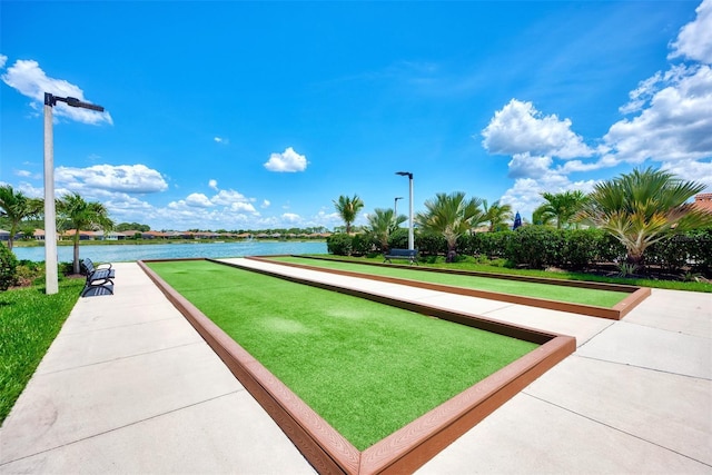 surrounding community with a water view