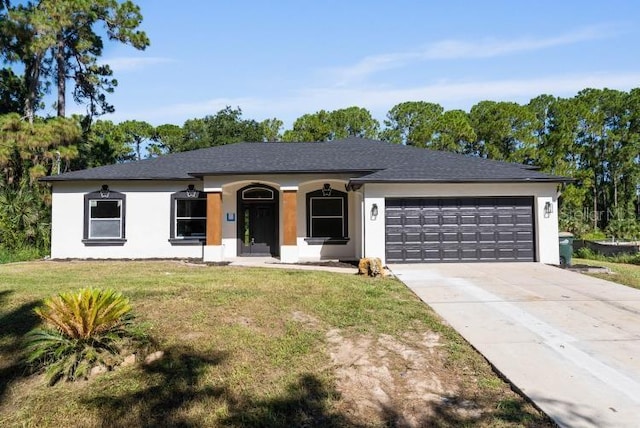ranch-style home with driveway, an attached garage, stucco siding, and a front yard