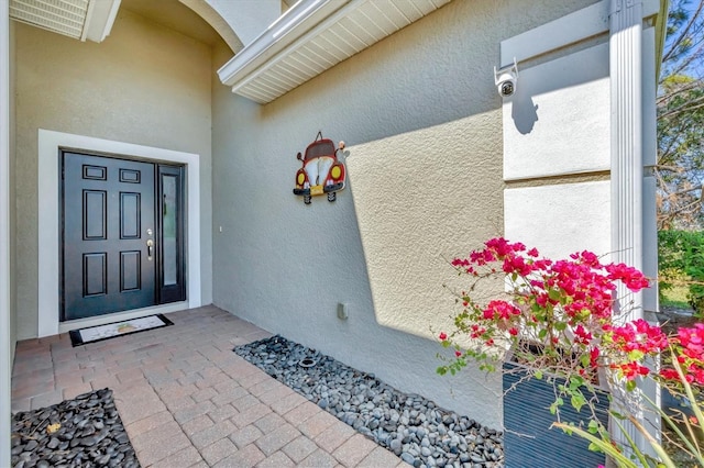 9312 Coachman Dr, Venice, FL 34293 - view of exterior entry with stucco siding