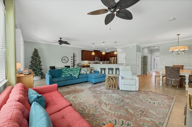 9312 Coachman Dr, Venice, FL 34293 - living area featuring light tile patterned floors, ceiling fan with notable chandelier, and ornamental molding
