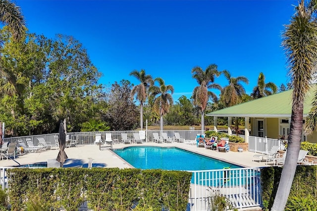 9312 Coachman Dr, Venice, FL 34293 - community pool featuring a patio area and fence