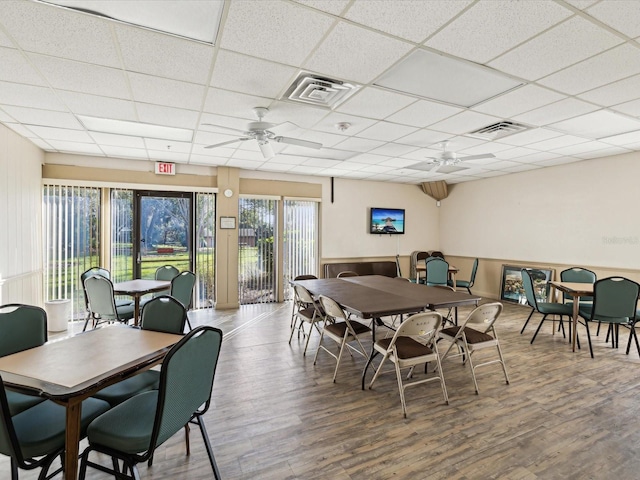 dining space featuring visible vents, wood finished floors, and ceiling fan