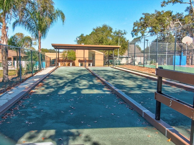 view of home's community with fence