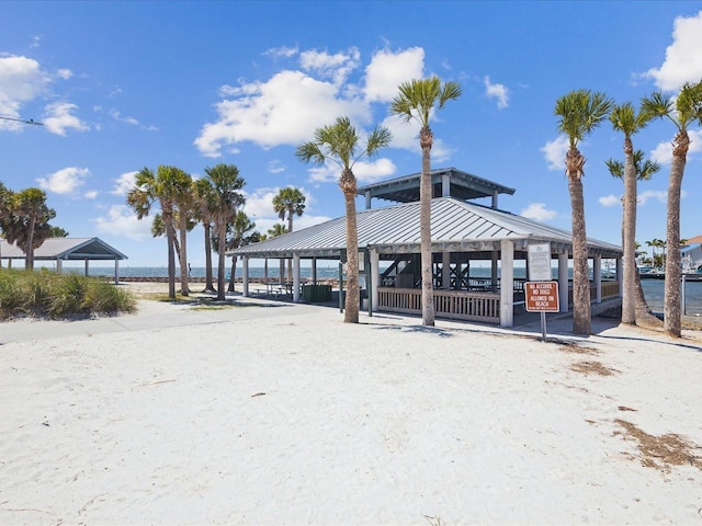 view of property's community with a gazebo and a water view