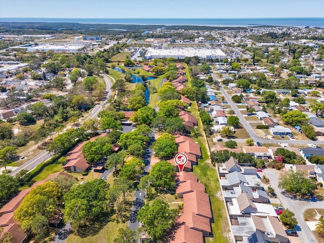 bird's eye view with a residential view and a water view