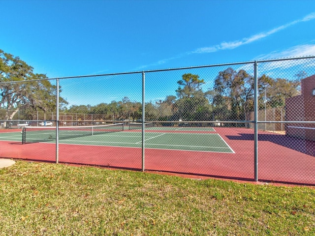 view of sport court with fence