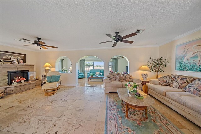 1003 N Gondola Dr, Venice, FL 34293 - living room with a ceiling fan, visible vents, and ornamental molding