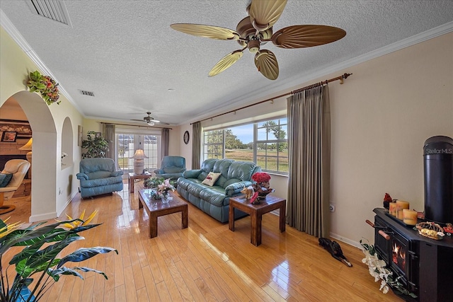 1003 N Gondola Dr, Venice, FL 34293 - living room featuring visible vents, light wood-style flooring, and a ceiling fan