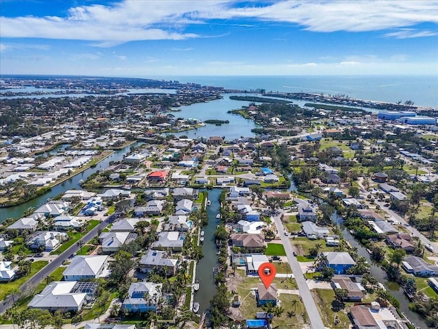 bird's eye view featuring a residential view and a water view