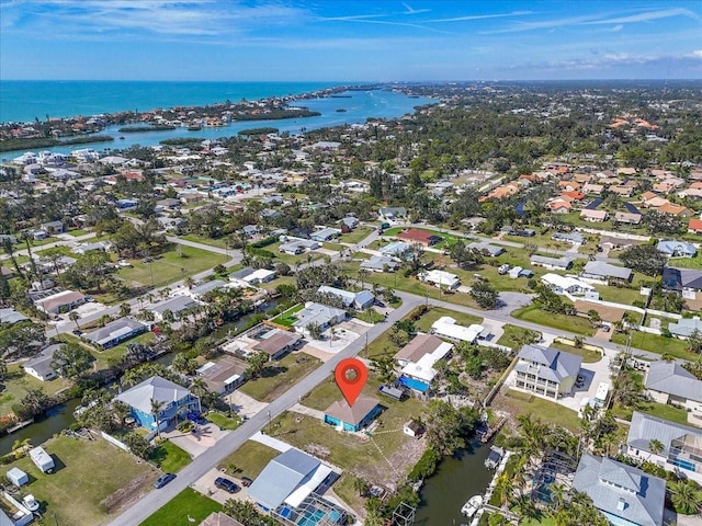 bird's eye view with a water view and a residential view