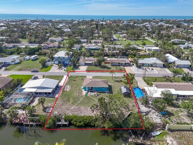 bird's eye view with a residential view and a water view