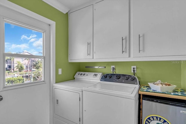 laundry area with cabinet space and washing machine and clothes dryer
