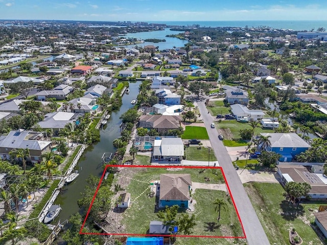 bird's eye view featuring a residential view and a water view