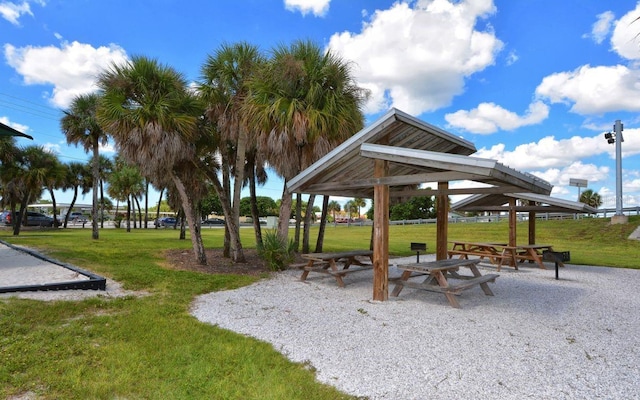 view of home's community with a lawn and a gazebo