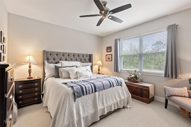 11655 Renaissance Blvd, Venice, FL 34293 - bedroom with a ceiling fan, light carpet, and baseboards