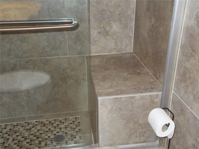 full bathroom featuring a stall shower