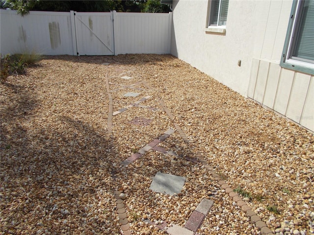 view of yard with a gate and fence