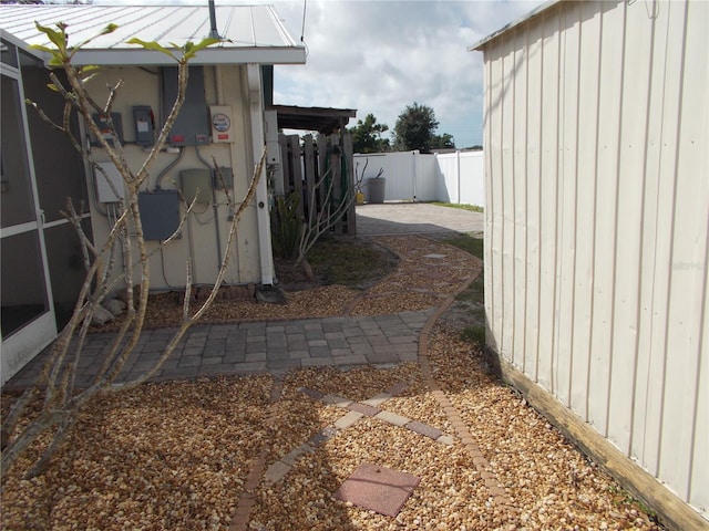 view of yard featuring fence and a patio area