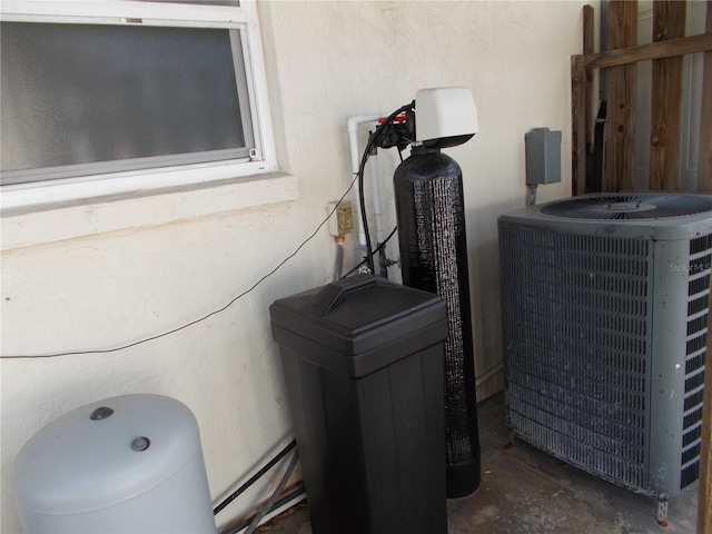 exterior details with stucco siding and central air condition unit