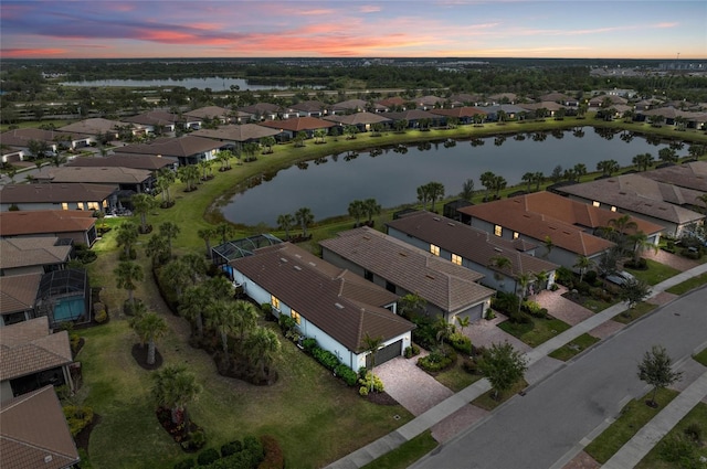 birds eye view of property featuring a residential view and a water view