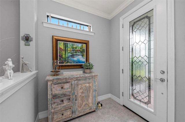 foyer entrance with light tile patterned flooring, baseboards, and crown molding