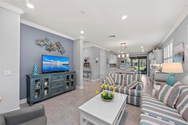 living room with baseboards, recessed lighting, ornamental molding, and a chandelier