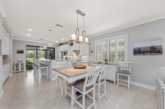 dining area with baseboards, visible vents, recessed lighting, and crown molding