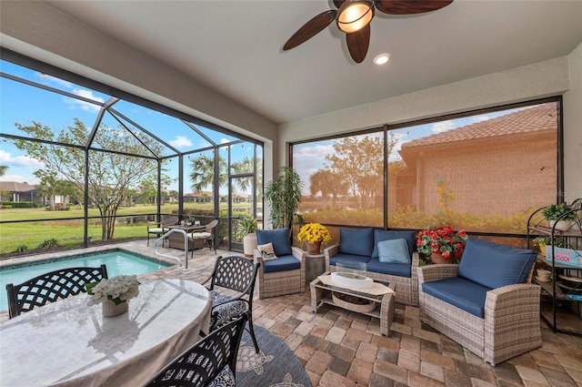 sunroom / solarium featuring an outdoor hangout area and a ceiling fan
