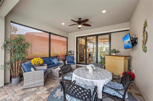 view of patio with outdoor lounge area and a ceiling fan
