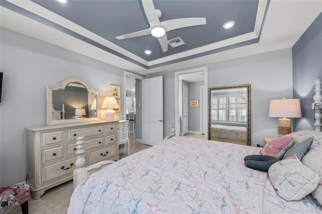 bedroom featuring light tile patterned flooring, visible vents, crown molding, and a raised ceiling