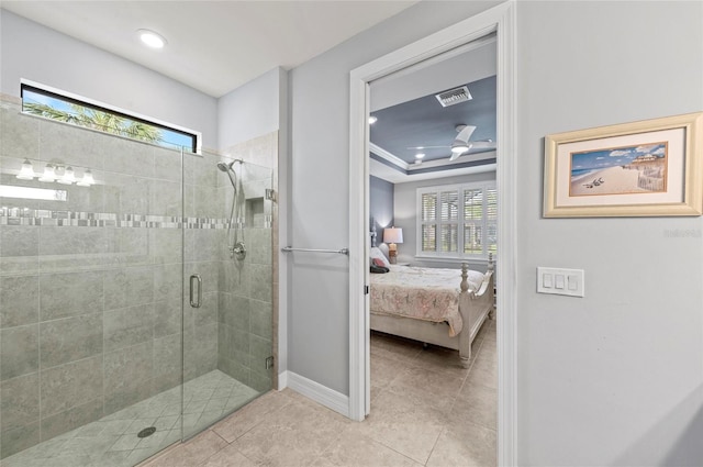 full bath with tile patterned flooring, baseboards, a shower stall, connected bathroom, and visible vents