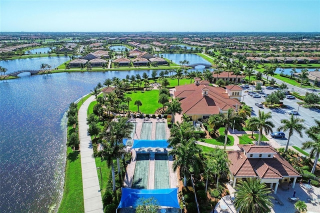 bird's eye view with a residential view and a water view