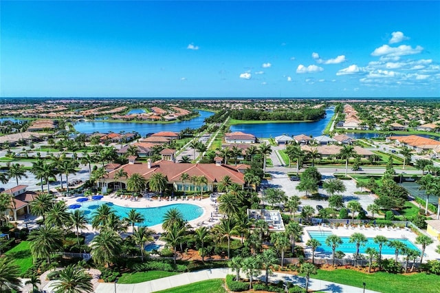 drone / aerial view with a residential view and a water view