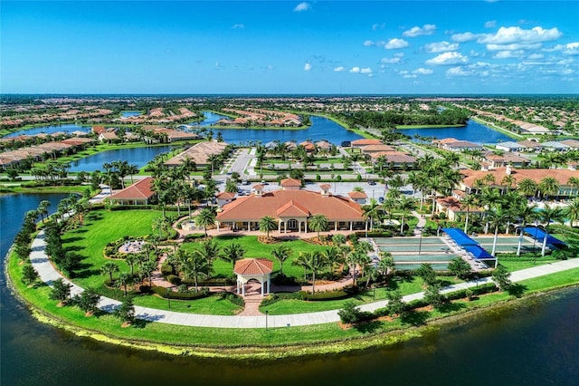 drone / aerial view featuring a residential view and a water view