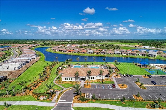 birds eye view of property with a water view and a residential view