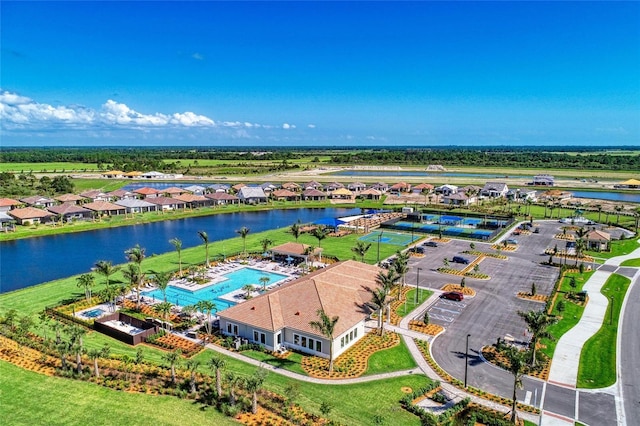 drone / aerial view with a residential view and a water view